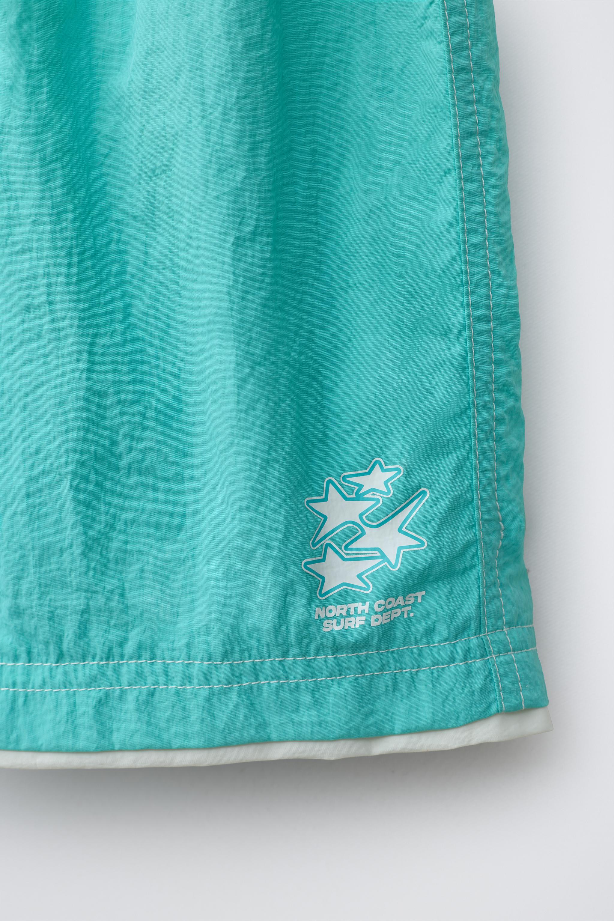 AGES 6-14 / SWIM SHORTS WITH DOUBLE CONTRAST HEM